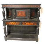 19TH CENTURY CARVED OAK AND PENWORK COURT CUPBOARD The signed door opening to reveal a shelved