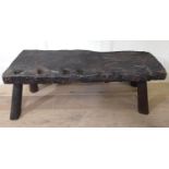 A 17TH/18TH CENTURY SOLID OAK PIG BENCH The 3" top with iron clamp and four square holed sections,