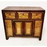 AN EARLY 20TH CENTURY CHINESE SIDE CABINET With three drawers above two cupboards with heavily
