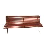 A TENNIS COURT/GARDEN BENCH With teak slats on wrought iron supports. (200cm x 70cm x 76cm)