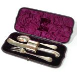 A CASED VICTORIAN SILVER CHRISTENING SET Comprising a pistol grip knife, fork, spoon and serviette