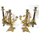 THREE PAIRS OF 19TH CENTURY GILT METAL CANDLESTICKS Two of Regency design with reeded columns and