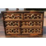 A 17TH CENTURY SPANISH WALNUT AND BONE INLAID TABLE TOP CHEST Of six drawers fitted with