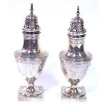 A PAIR OF GEORGE III SILVER CASTERS Classical form with fine engraved decoration of swags and