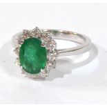 AN 18CT WHITE GOLD AND EMERALD RING The 2.01 emerald surrounded by diamonds (size N).