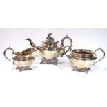 A VICTORIAN SILVER THREE PIECE TEA SERVICE Comprising a large teapot with floral finial, sugar basin