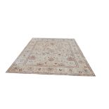 AN INDIAN AGRA RUG Traditional design with central floral madder field contained within five running