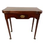 AN 18TH CENTURY SOLID MAHOGANY FOLD OVER CARD TABLE The shaped top opening to reveal a green baize