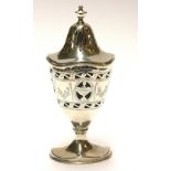 AN EARLY 20TH CENTURY SILVER CASTER Classical form with pierced border and glass liner, hallmarked