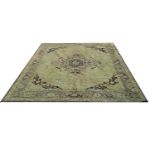 A BELGIUM HERIZ RUG With central medallion, on an olive ground. (280cm x 360cm)