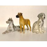 THREE RUSSIAN 20TH CENTURY STATUES OF DOGS. (largest 18cm)