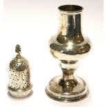 A GEORGIAN SILVER BALUSTER CASTER Having a pierced dome lid, with engraved armorial crest ?Dum