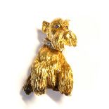 PETER LINDEMAN, A VINTAGE 18CT GOLD, DIAMOND AND SAPPHIRE BROOCH Modelled as a Scottie dog with