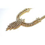 A 9CT GOLD AND DIAMOND ENCRUSTED NECKLACE Set in the form of floral sprays, with 18k extension