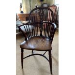 AN EARLY 19TH CENTURY YEW AND ELM WOOD WINDSOR CHAIR With spindle and pierced back over solid