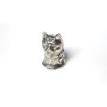 A SILVER NOVELTY VESTA CASE Modelled as a cat's head with necktie, marked Sterling. (approx 3cm) (