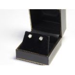 A PAIR OF 18CT WHITE GOLD AND DIAMOND STUD EARRINGS Single ring cut stone. (approx total diamond