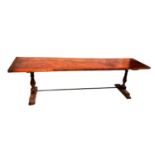 A 19TH CENTURY AND LATER FRUITWOOD REFECTORY TABLE The single plank top, raised on two bulbous