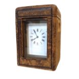 A 19TH CENTURY GILT BRASS REPEATING CARRIAGE CLOCK Four bevelled glass panels, visual balance