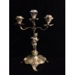 AN EARLY 20TH CENTURY CONTINENTAL SILVER FIGURAL CANDELABRA Three branch with a winged cherub and