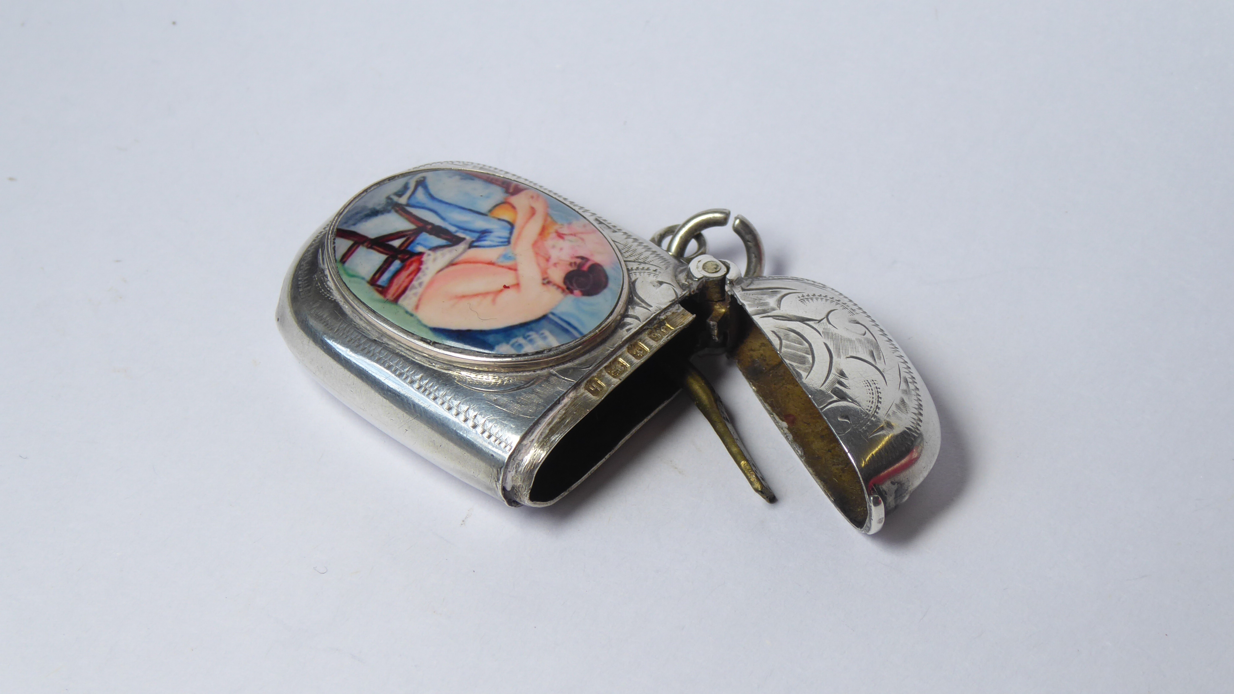 A SILVER AND ENAMEL OVAL VESTA CASE With modern enamel seated nude, hallmarked Birmingham, 1907. ( - Image 2 of 3