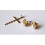 A PAIR OF 9CT GOLD AND PEARL EARRINGS Stud form with pierced mount.