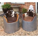 A PAIR OF 20TH CENTURY ALUMINIUM INDUSTRIAL TUB ARMCHAIRS With cowhide and leather upholstery. (59cm