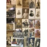 A COLLECTION OF THIRTY MILITARY WWI AND WWII PHOTOGRAPHIC POSTCARDS Including sweetheart cards. (