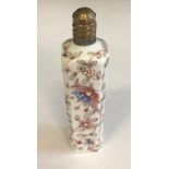 A 19TH CENTURY FRENCH SOFT PASTE SCENT BOTTLE With hand painted floral enamelled decoration. (10cm)