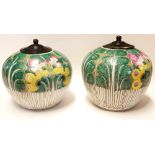 A PAIR OF 19TH CENTURY CHINESE FAMILLE VERTE GINGER JARS Spherical form with turned wooden covers,