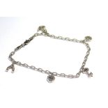 AN 14CT WHITE GOLD AND DIAMOND CHARM BRACELET Having five diamond set charms including a lucky