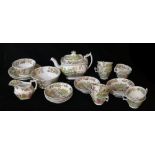 AN EARLY 19TH CENTURY ENGLISH POTTERY TEA SERVICE Decorated in a Chinese tea drinking ceremony