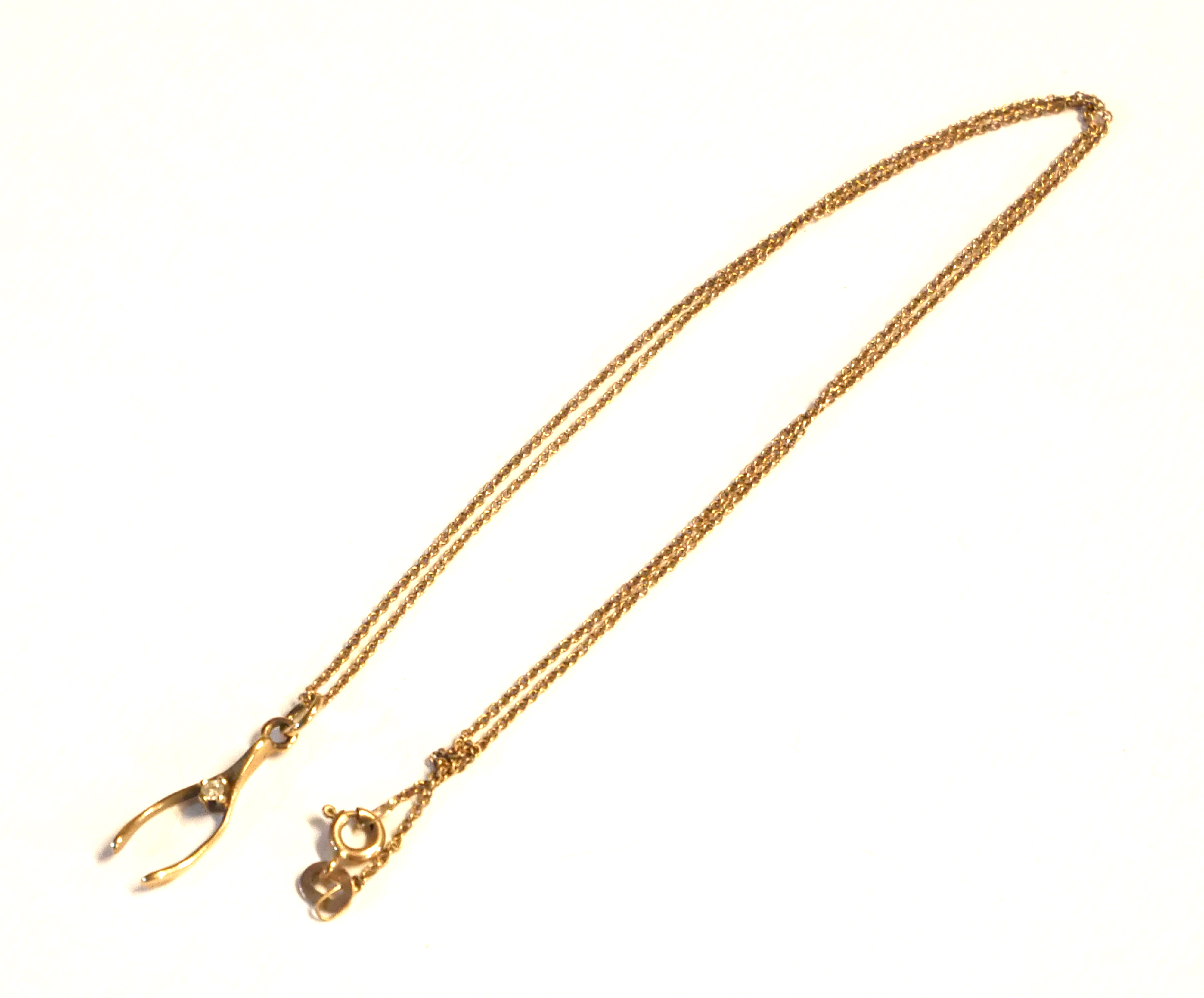 A VINTAGE 9CT GOLD AND DIAMOND PENDANT WISHBONE NECKLACE With a five link chain, together with two - Image 4 of 4