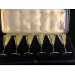 A CASED SET OF SIX EARLY 20TH CENTURY SILVER VODKA CUPS Plain form, hallmarked J.C. Vickery,