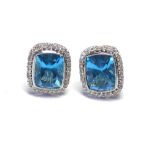 A PAIR OF 18CT WHITE GOLD, BLUE TOPAZ AND DIAMOND EARRINGS Baguette cut topaz stones edged with