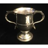 A GEORGIAN SILVER TWIN HANDLED CUP Plain form, hallmarked to base Joseph Herriot, London, 1776. (