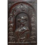 AN ANTIQUE CARVED OAK PANEL, PORTRAIT OF A 16 TH/17 TH CENTURY GENTLEMAN Floral border. (34cm x