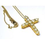 A 14K GOLD CRUCIFIX SET WITH 3.73CT OF ROUND CUT DIAMONDS On a 14k gold chain. (3.1cm x 2.5cm)