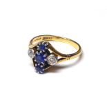 AN ART DECO 18CT GOLD, DIAMOND AND PASTE SET RING Three paste stones flanked by diamonds (size