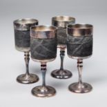AN EARLY 20TH CENTURY TAXIDERMY SET OF FOUR ELEPHANT HIDE WINE GOBLETS. (h 18cm)