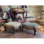 A PAIR OF EARLY 19TH CENTURY MAHOGANY FOOTSTOLLS The shaped upholstered seat raised on cabriolet
