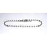 AN 18K WHITE GOLD BRACELET SET WITH 0.49 CT OF ROUND CUT DIAMONDS. (18cm) weight approx 6gm.