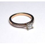 AN 18CT GOLD RING SET WITH A 0.50CT PRINCESS CUT DIAMOND On diamond shoulders (size K). weight