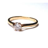 AN 18K ROSE GOLD SOLITAIRE RING Set with a 0.30ct round brilliant cut diamond (size L). weight