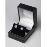 A PAIR OF 18CT WHITE GOLD AND DIAMOND STUD EARRINGS. (diamond weight 1.85ct) Colour 1 S3 Diamonds