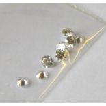 A COLLECTION OF LOOSE ROUND CUT DIAMONDS Comprising nine 3mm stone.