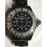 CHANEL, J12, A BOXED CERAMIC AND DIAMOND LADIES WRISTWATCH Having a rotating diamond bezel, calendar