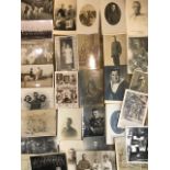 A COLLECTION OF THIRTY MILITARY WWI AND WWII PHOTOGRAPHIC POSTCARDS Including family scenes. (approx