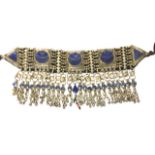 A CONTINENTAL BRASS AN LAPIS LAZULI COSTUME BELT Having geometric form stones and tassel drops. (