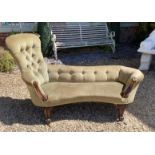 A VICTORIAN MAHOGANY FRAMED TWO SEAT WINDOW CHAISE LOUNGE Button back green velvet upholstery. (